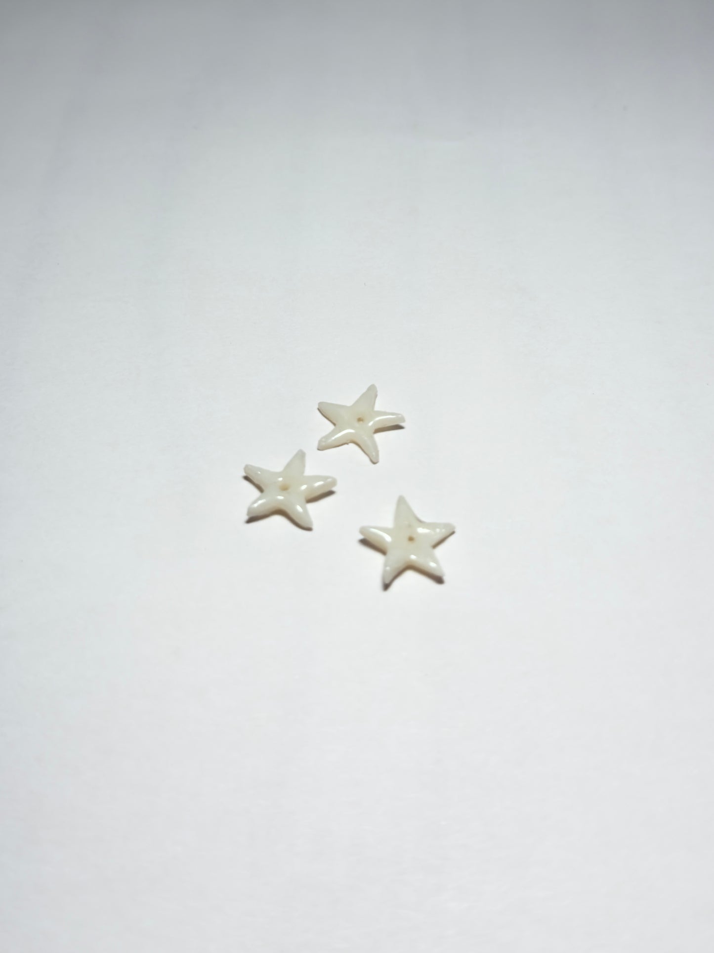 Charms étoile blanche